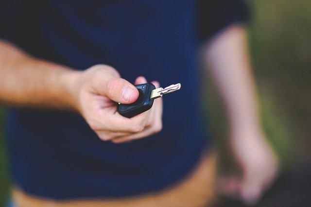 Person holding car keys