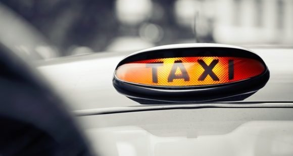 Illuminated taxi sign on a cab roof